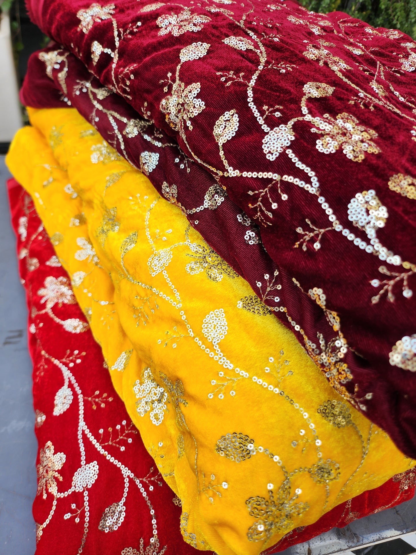 Pure velvet 9000 fabric and comes with beautiful floral trail embroidery yellow color with hand woven sequence work