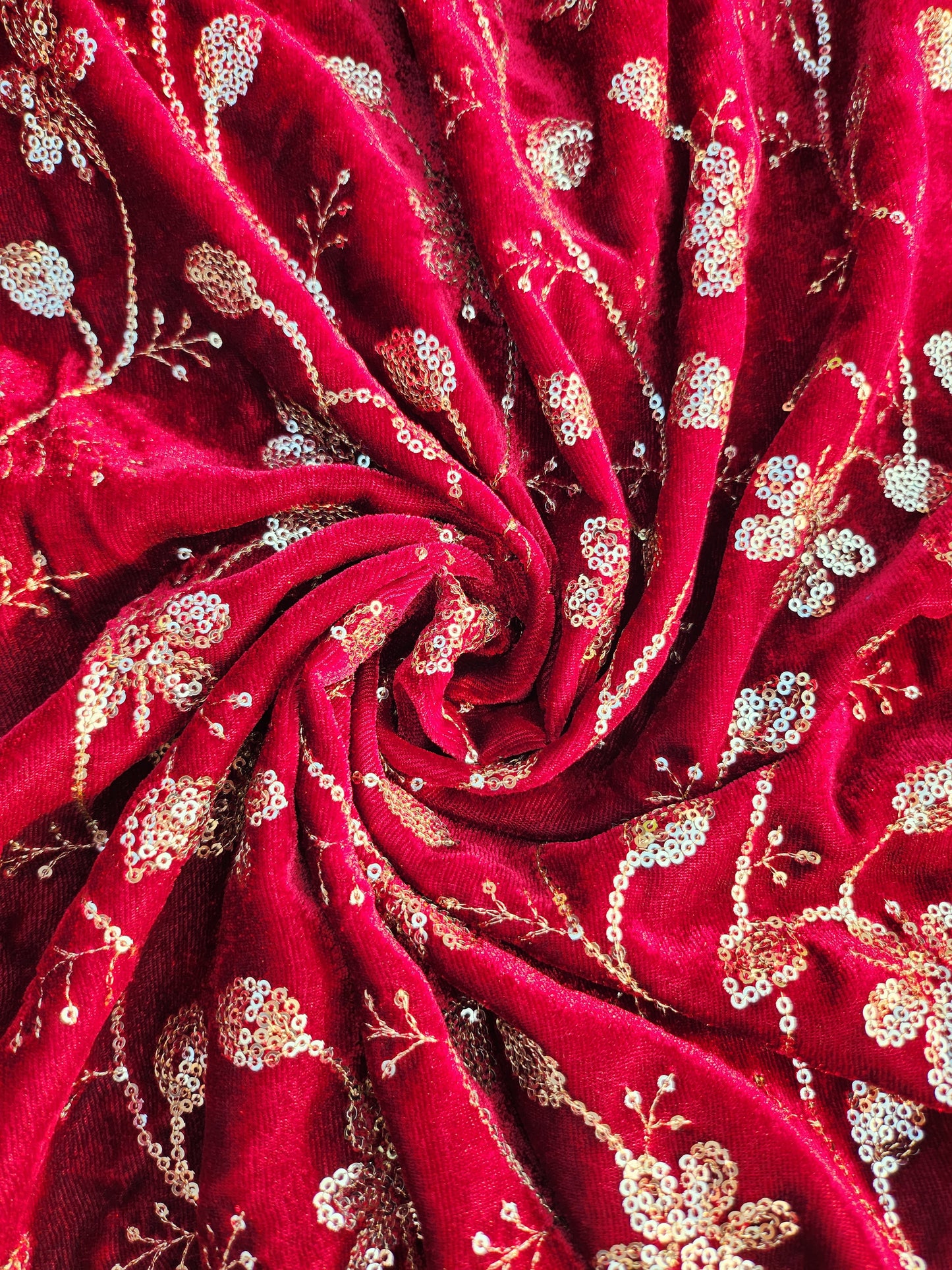 Pure velvet 9000 fabric and comes with beautiful floral trail embroidery maroon color with hand woven sequence work