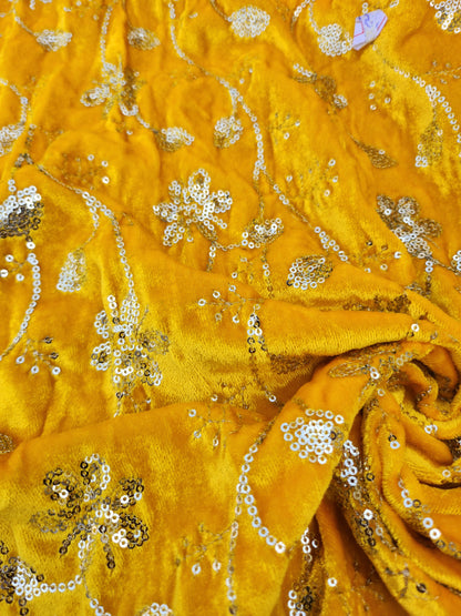 Pure velvet 9000 fabric and comes with beautiful floral trail embroidery yellow color with hand woven sequence work