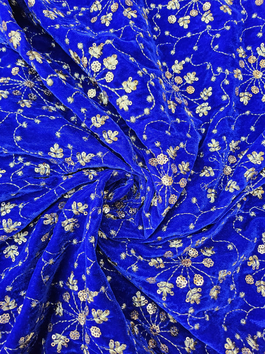 Pure velvet 9000 fabric and comes with beautiful floral trail embroidery blue color with hand woven sequence work