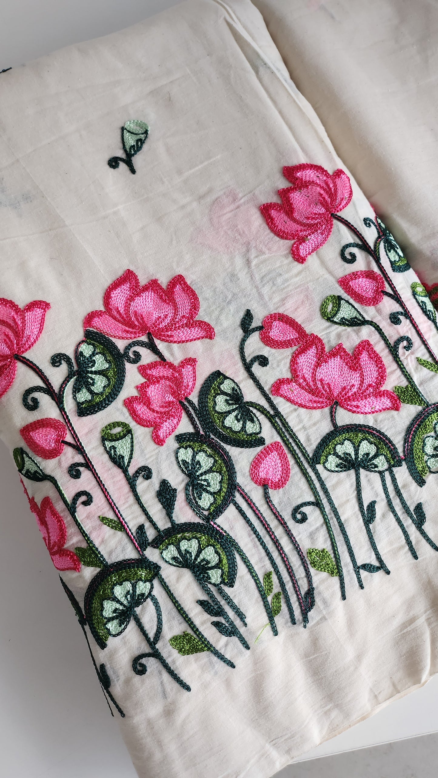 Pure kora cotton with beautiful lotus and leaf embroidery work with daman and butti all over